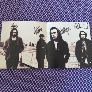 THE 1975 AUTOGRAPHED CD BOOK